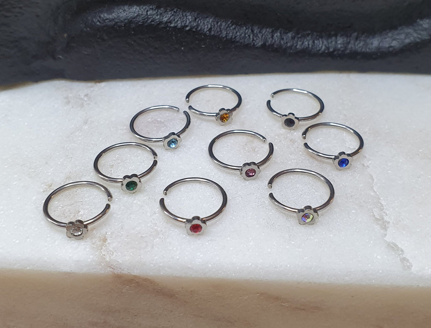 Continuous Ring with flower shaped top and crystal ( surgical steel )
