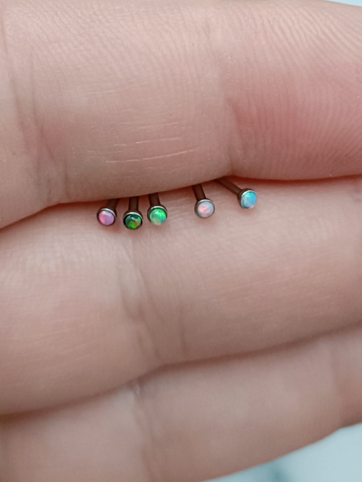 Straight nose stud with 1.5mm round synthetic opal ( surgical steel )