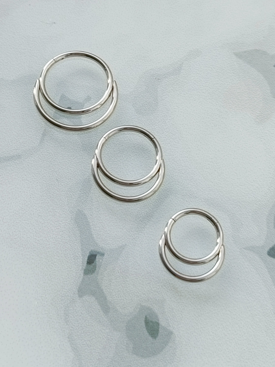 Piercing clicker hinged segment double rings ( surgical steel )