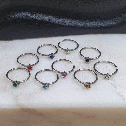 Continuous Ring with star shaped top and crystal ( surgical steel  )