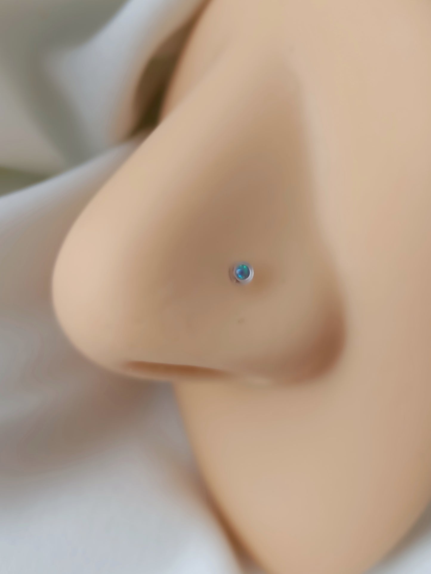 Straight nose stud with 1.5mm round synthetic opal ( acrylic )
