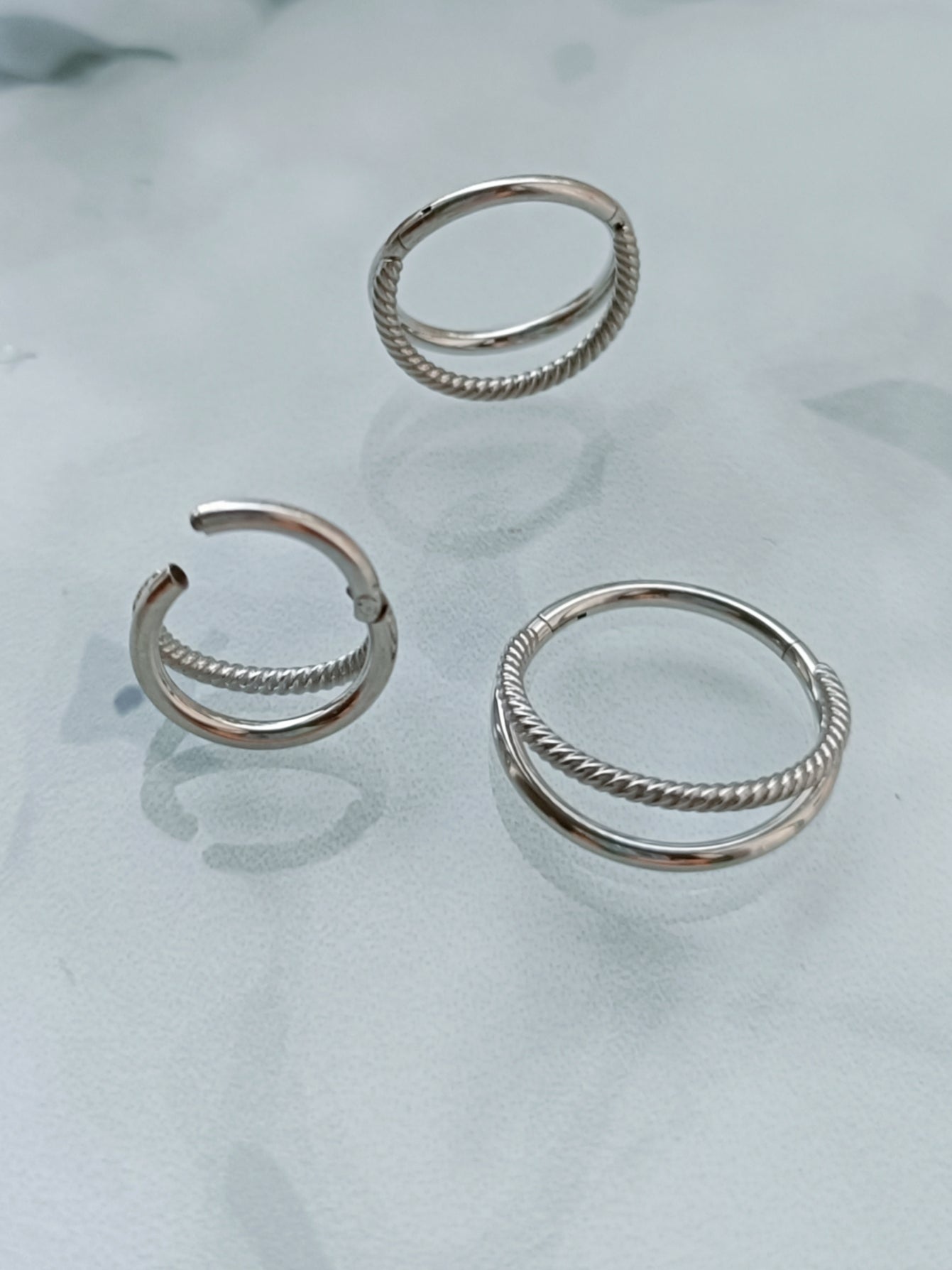 Piercing clicker hinged segment plain and twisted rings ( surgical steel )